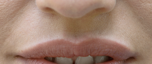 a close up of lips with a white area immediately above
